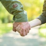 Road to life. Hands. Father’s and his son’s hands. Dad leading s